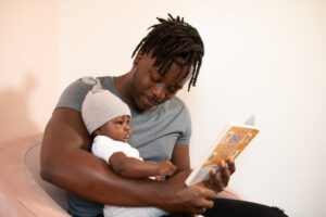 parent reading to a baby